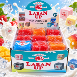 Laban Up Squishy 12Stk – bunte Anti-Stress-Spielzeuge im Laban-Drink-Design mit verschiedenen Farbvarianten im Verkaufsdisplay.